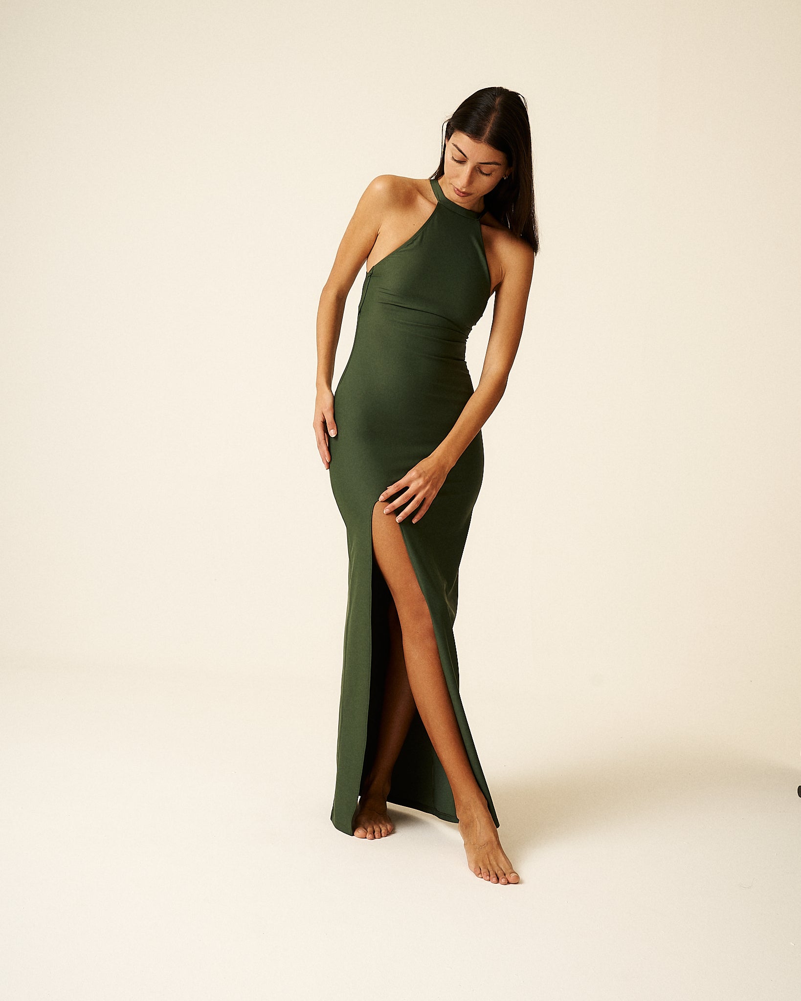 Discover Olivia, our exclusive sustainable luxury dress. Premium Econyl fiber offers elegance, comfort, and performance. Limited to 150 units, each certified and one-of-a-kind. Enjoy UPF50+ skin protection. Elevate fashion with purpose and indulge in our exquisite limited edition dresses. Green
